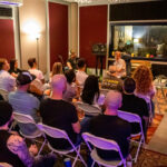 People in a recording studio for a album listening event